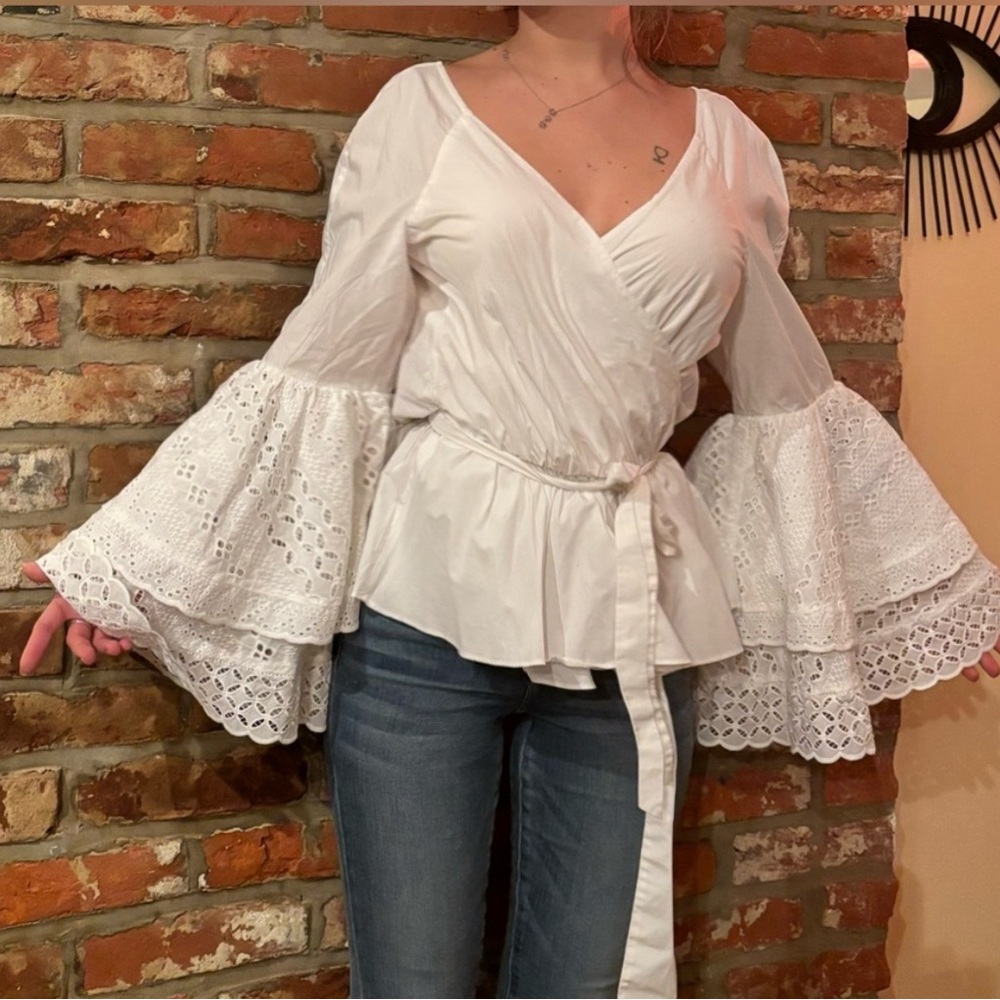 Rebecca Minkoff “Melly” top with belle sleeve and a wrap silhouette.